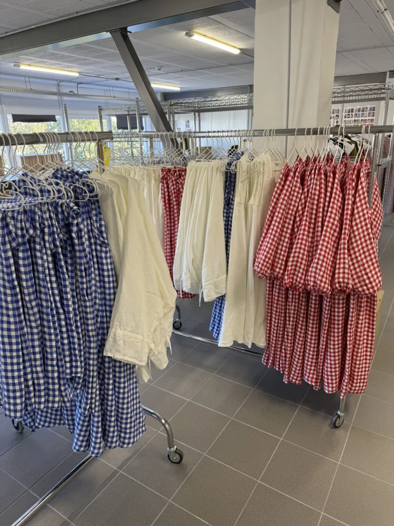 Linen garments on clothing racks in Linenfox production studio