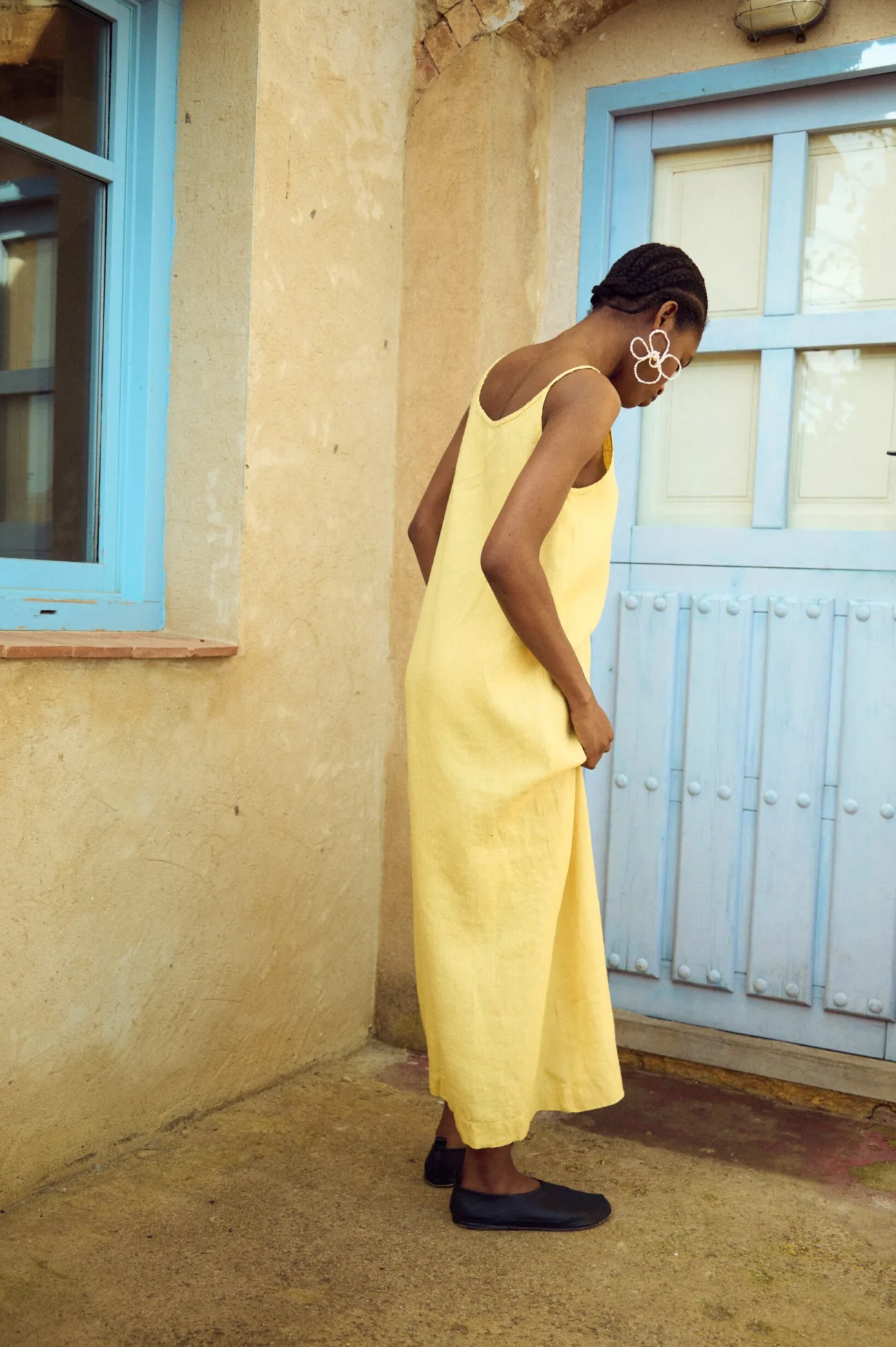 the back of minimalist butter maxi linen slip dress for summer style