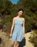 Light blue mini gingham dress with a smocked bodice and soft flared skirt