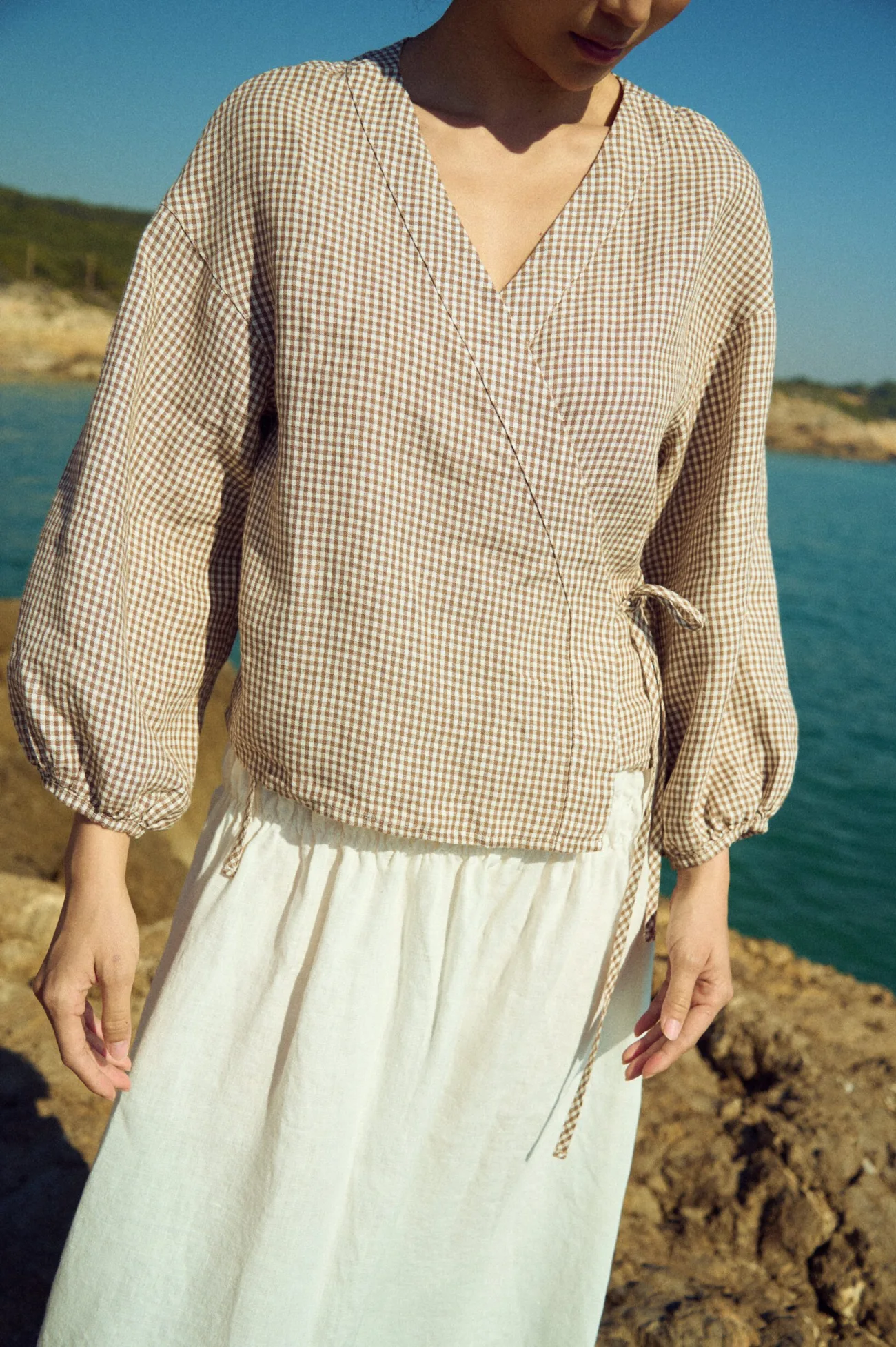 Lightweight brown gingham linen top with wrap construction and gentle drape