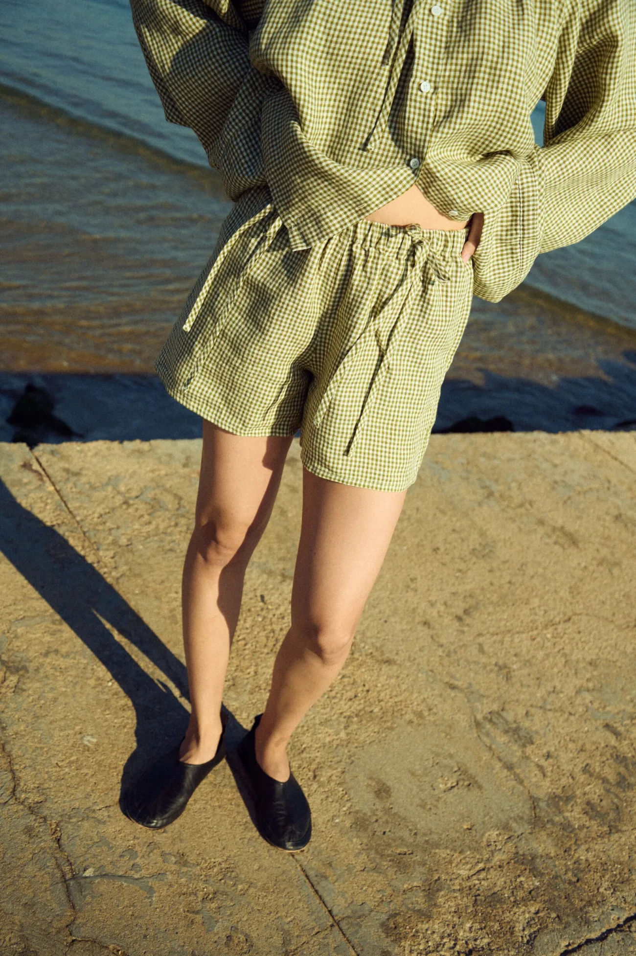 Moss green gingham linen shorts with relaxed fit and soft elastic waist with tie detail