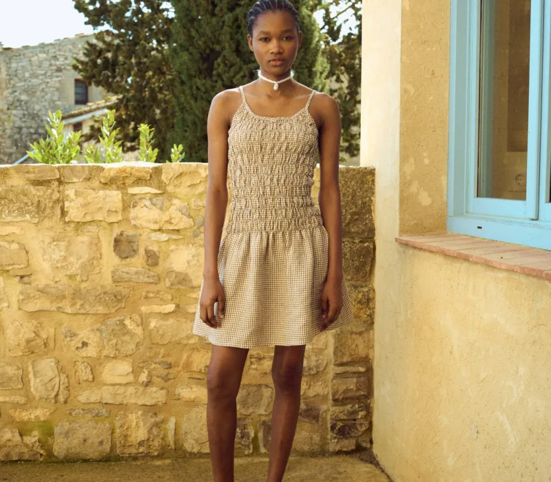 Brown gingham mini dress with textured ruching through the bodice and a loose hem