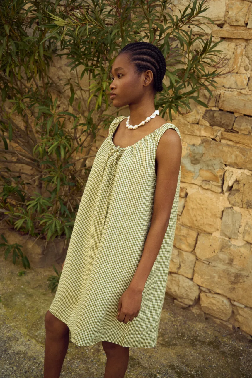 Moss green gingham linen sleeveless dress with gathered tie neckline and relaxed A-line fit