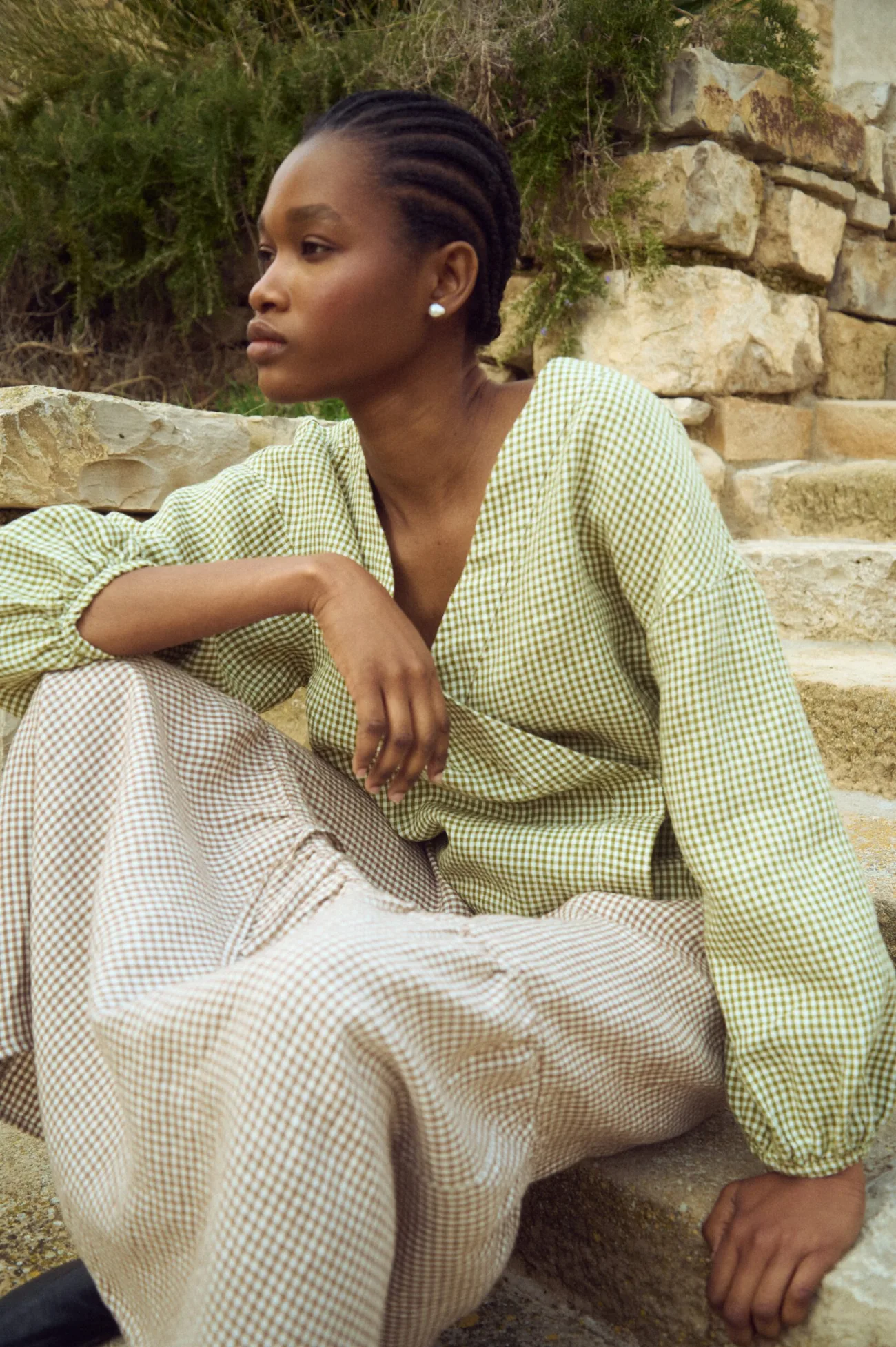 Brown gingham linen maxi skirt with gentle gathering and loose fit, styled with a lightweight linen wrap blouse