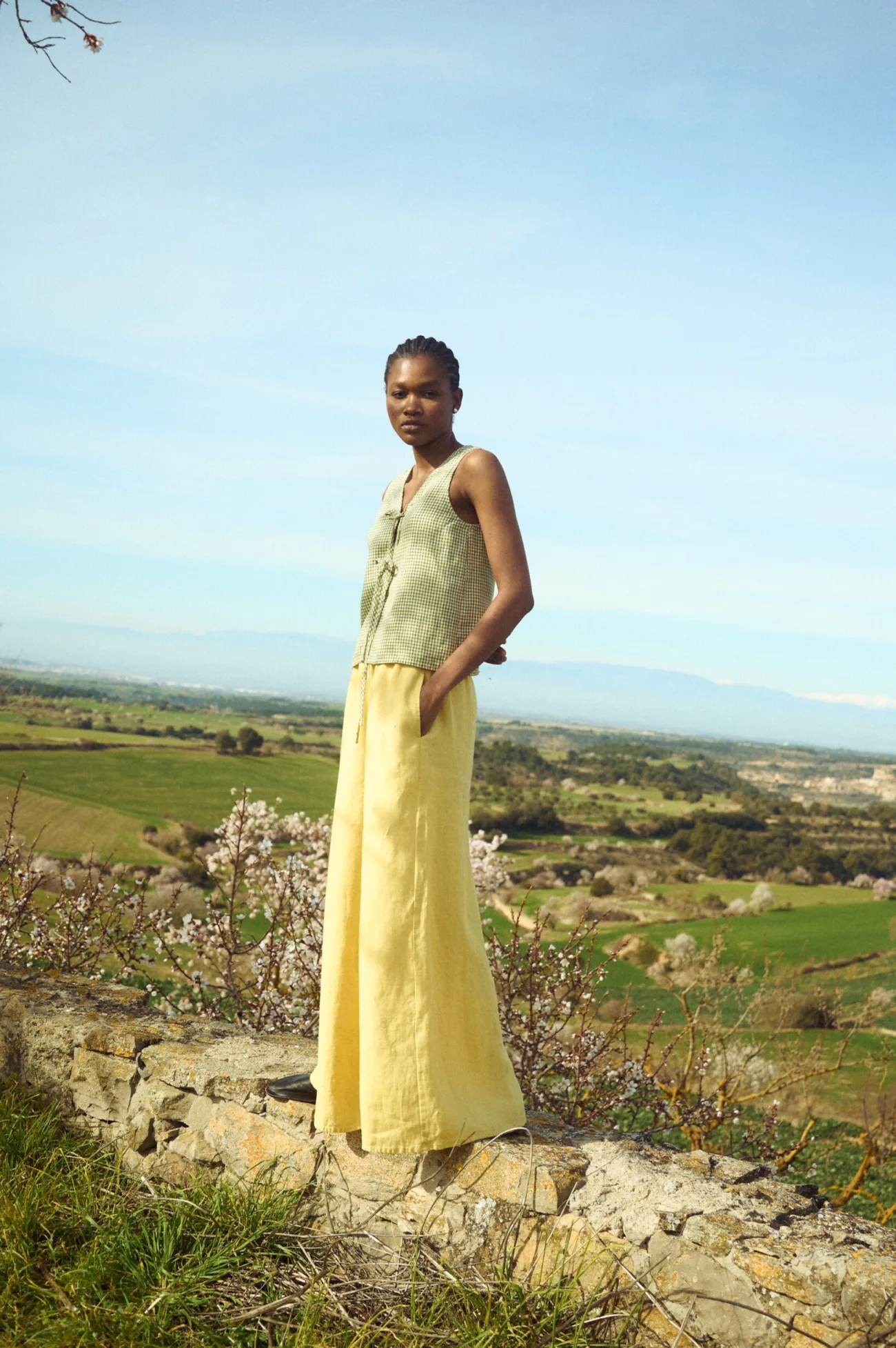 High-waisted butter linen culottes and gingham tie top full length view