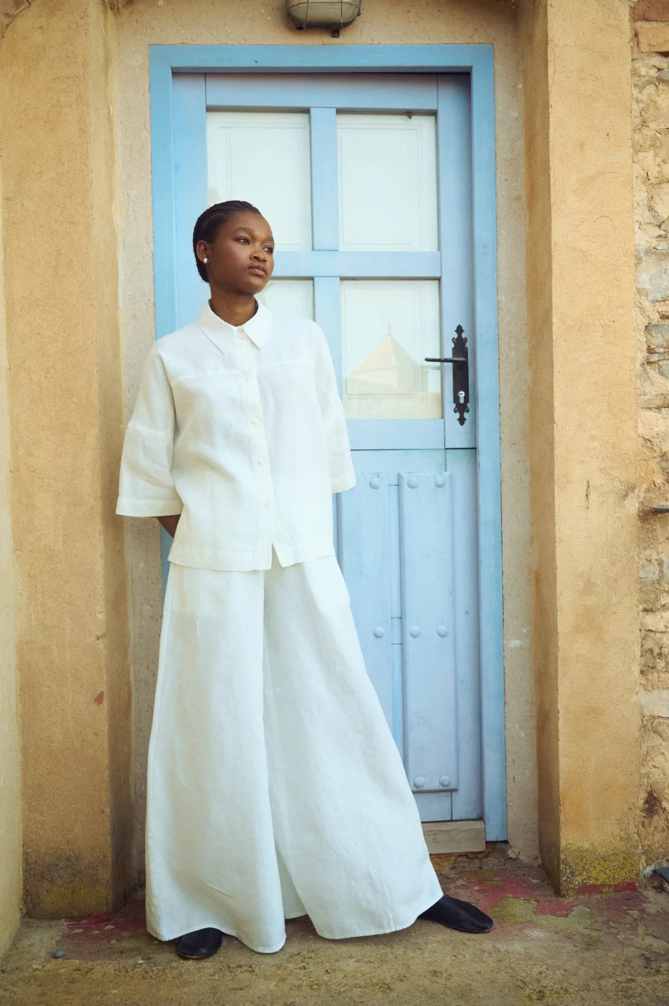 White linen culottes styled with oversized white linen shirt