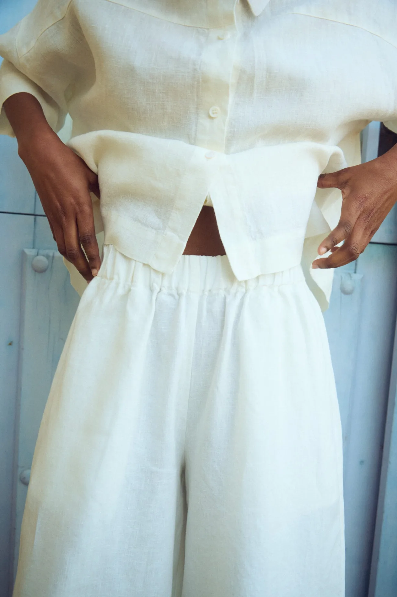 Close-up of white linen culottes and matching linen shirt