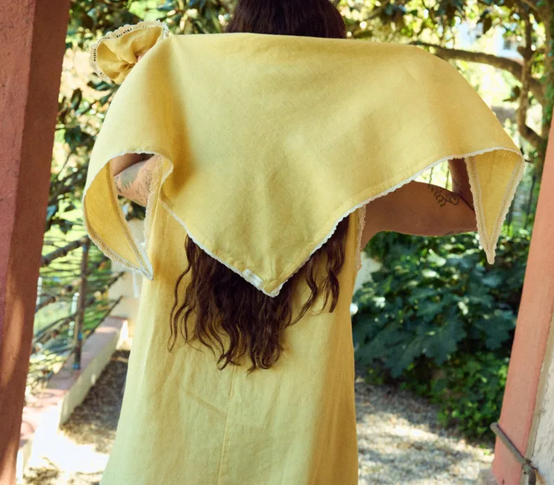 Yellow linen lace bandana tied on head with delicate lace trim edges