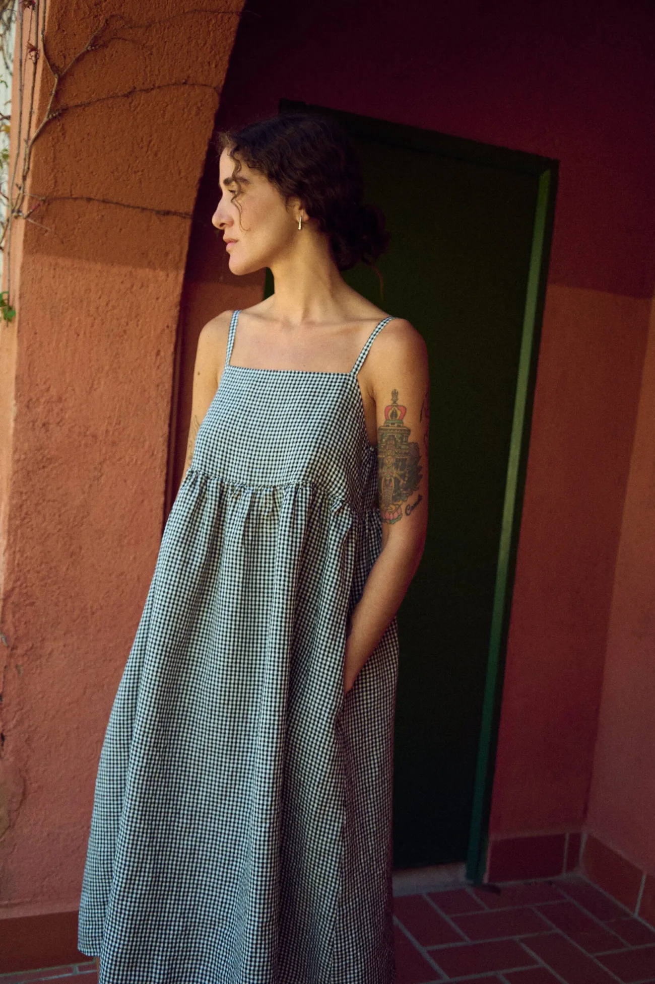 Black gingham dress with spaghetti straps and midi length