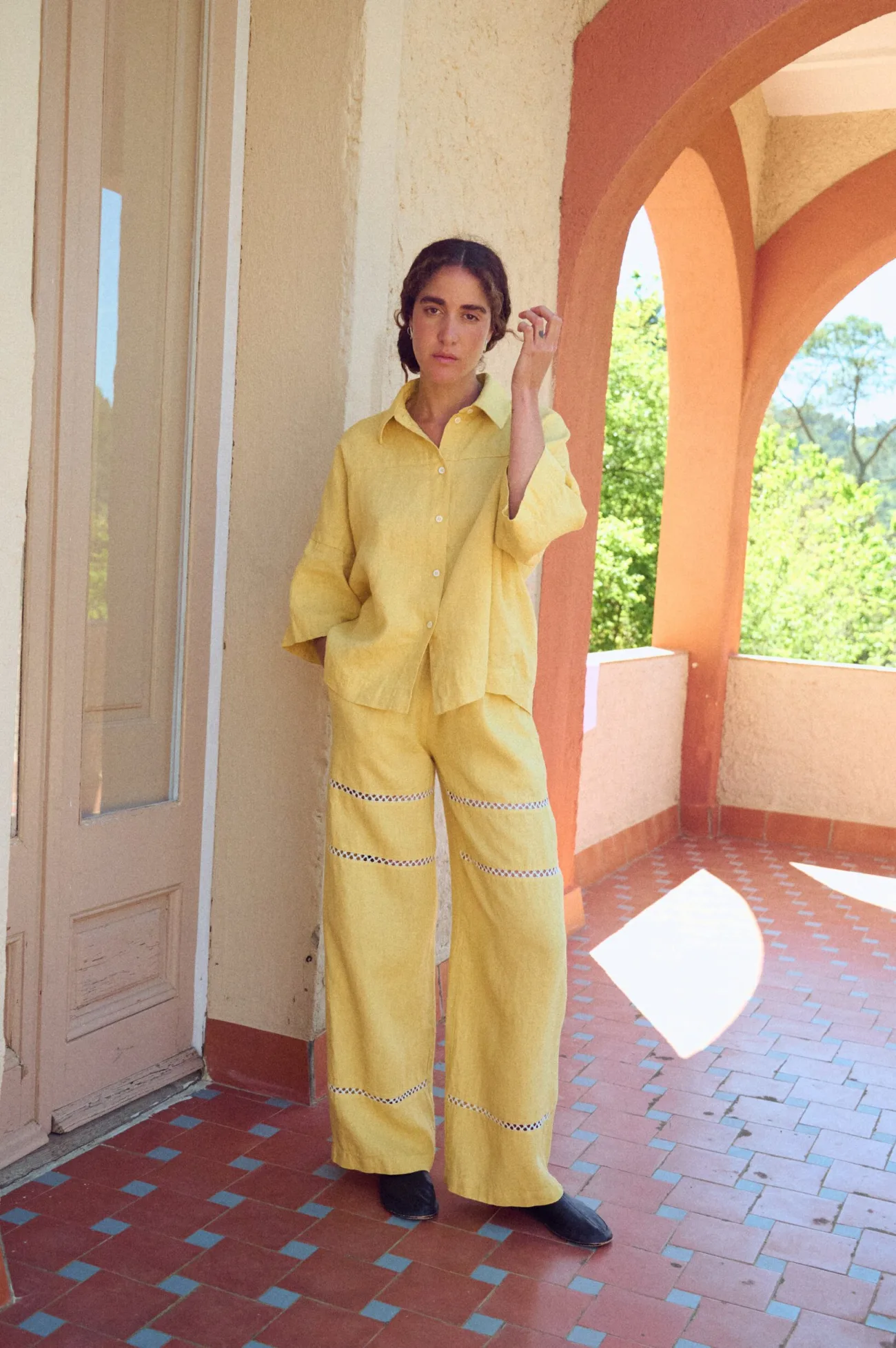 Summer linen pants in a long wide leg silhouette with lace inserts and side pockets