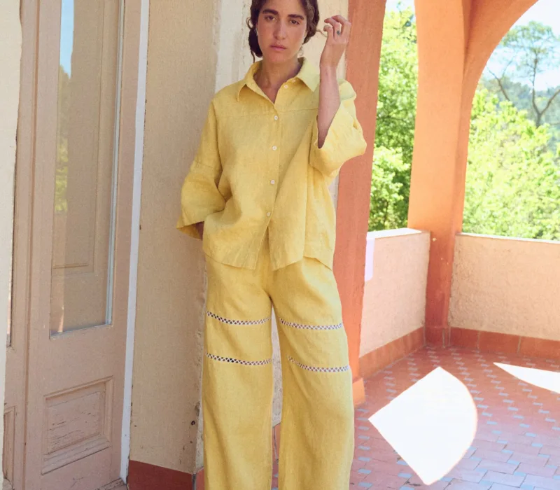 Summer linen pants in a long wide leg silhouette with lace inserts and side pockets