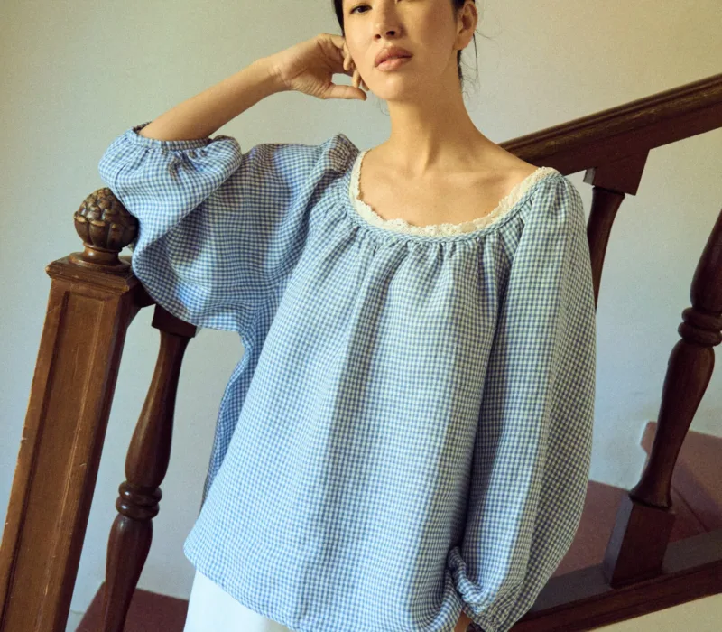 Blue gingham blouse with raglan sleeves and lace neckline