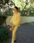 Straight fit linen drawstring trousers with side ties and lace detail. Minimal design without pockets.