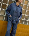 Blue denim linen jeans with wide legs, paired with a matching button-front linen jacket with patch pockets