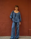 Blue striped linen wide-leg pants styled with a matching relaxed linen blouse