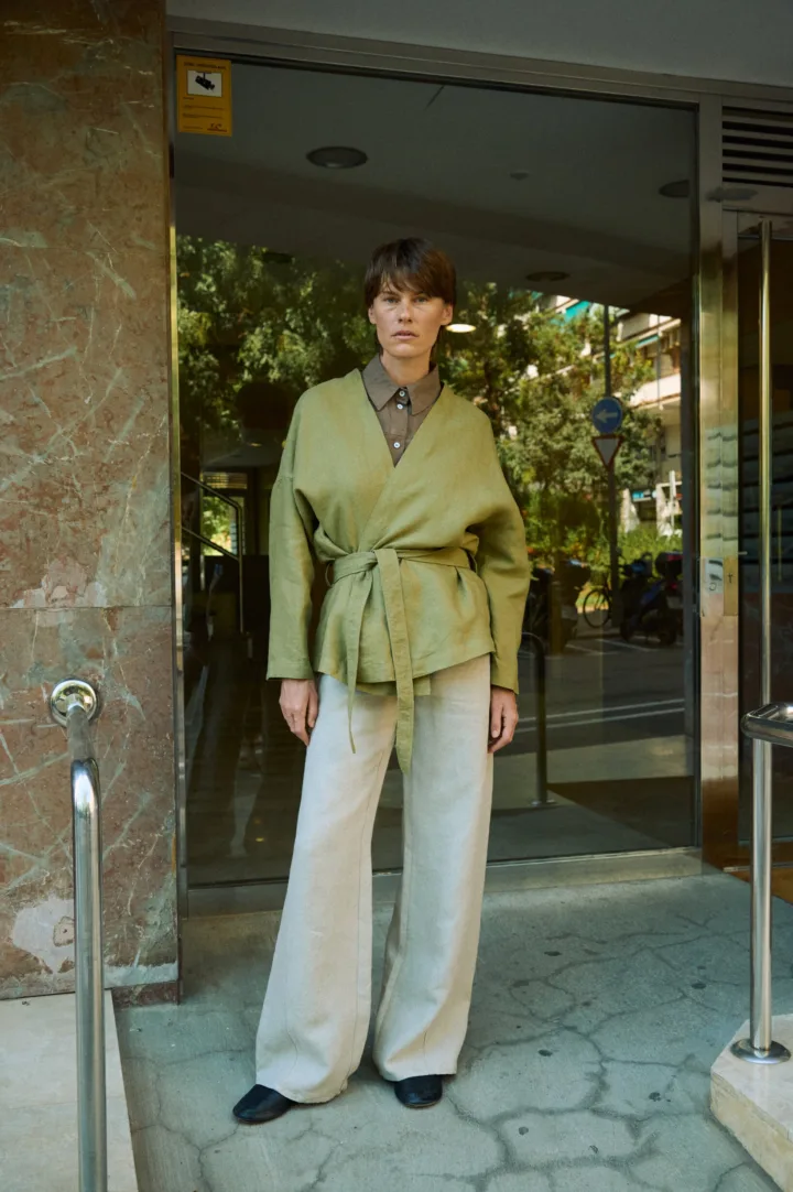 Natural grey heavy linen wide-leg trousers styled with an olive green wrap jacket and brown linen shirt