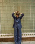 Blue denim linen pants with wide legs, styled with a matching button-down linen shirt