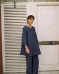 Denim linen midi dress with a relaxed A-line silhouette, styled over matching wide-leg trousers